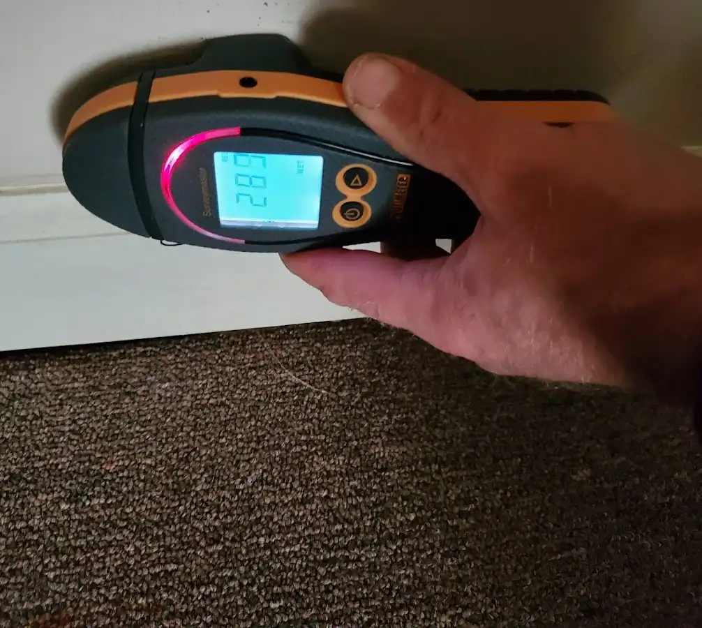 Moisture detection at baseboard during Storm Damage Restoration in Pine Bluff